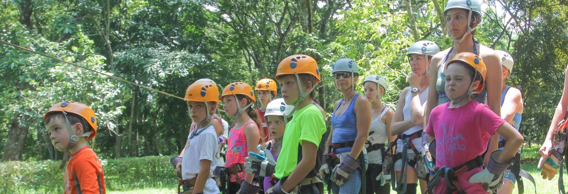 children listening to instructions to do canopy tour