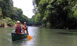 A Canadian couple navigates the river in a canoe on March 22, 2013.
