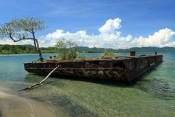An old barge rusts in the salt water off the coast of Playa Negra on Oct. 7, 2013.