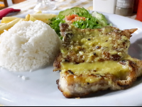        Grilled Fish Over Garlic Sauce At Perla Del Sur Restaurant
  - Costa Rica