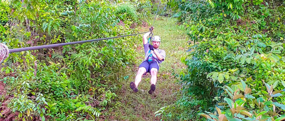 man zip linning on corcovado canopy tour
 - Costa Rica