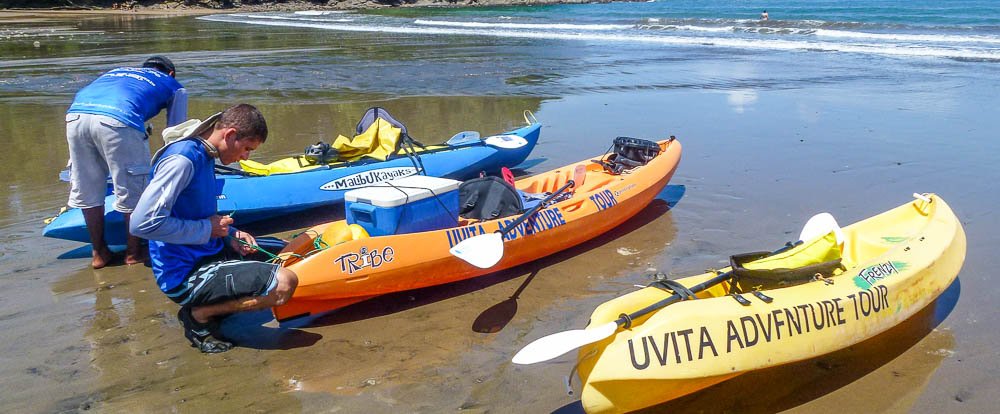 waves and caves tour three kayaks 
 - Costa Rica